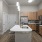 a kitchen with a prep island
