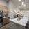 a kitchen with wooden cabinets